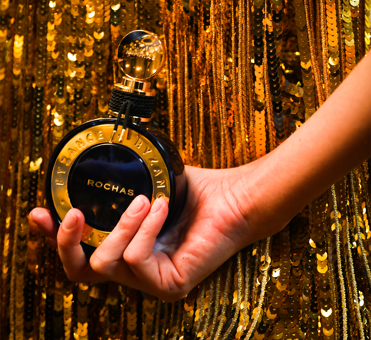 woman holding rocha fragrance