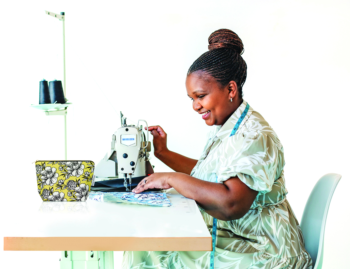 Elizabeth Arden Continues Commitment to Empowering Women Through Collaboration with Non-Profit Organisation Sparrow Society 1 woman sewing for Elizabeth Arden and sparrow society women empowerment campaign
