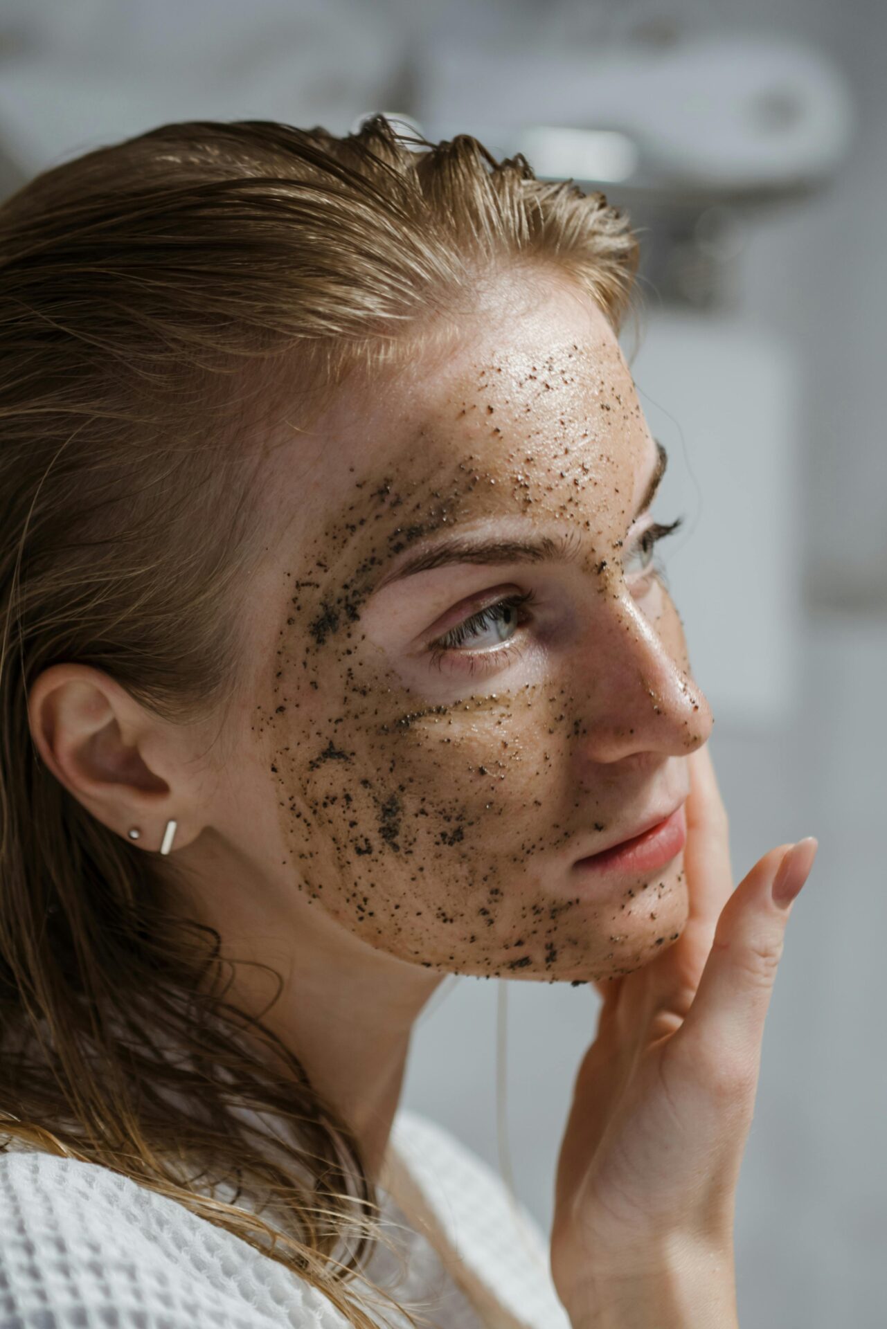 woman doing skin exfoliation