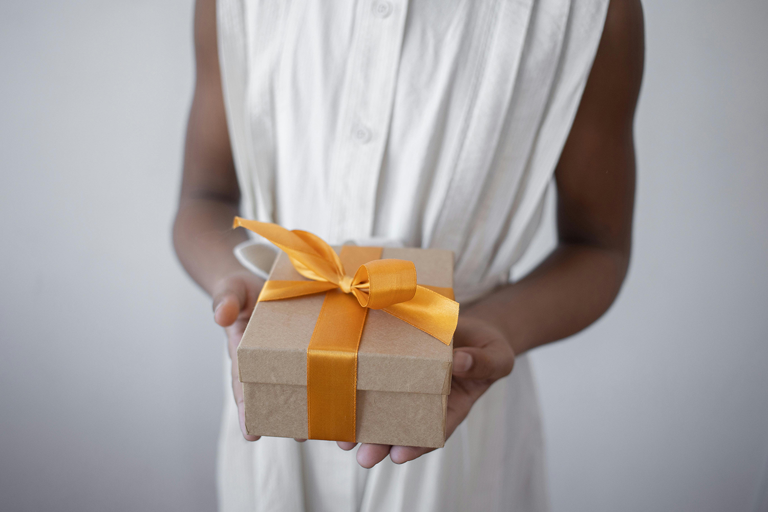 woman giving prize box to january 2025 winners