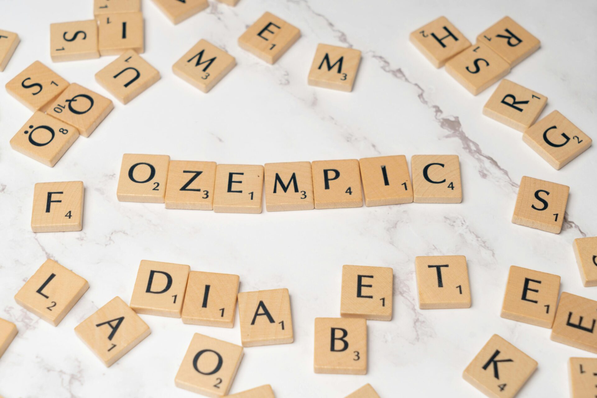 letters spelling "ozempic" for ozempic face article