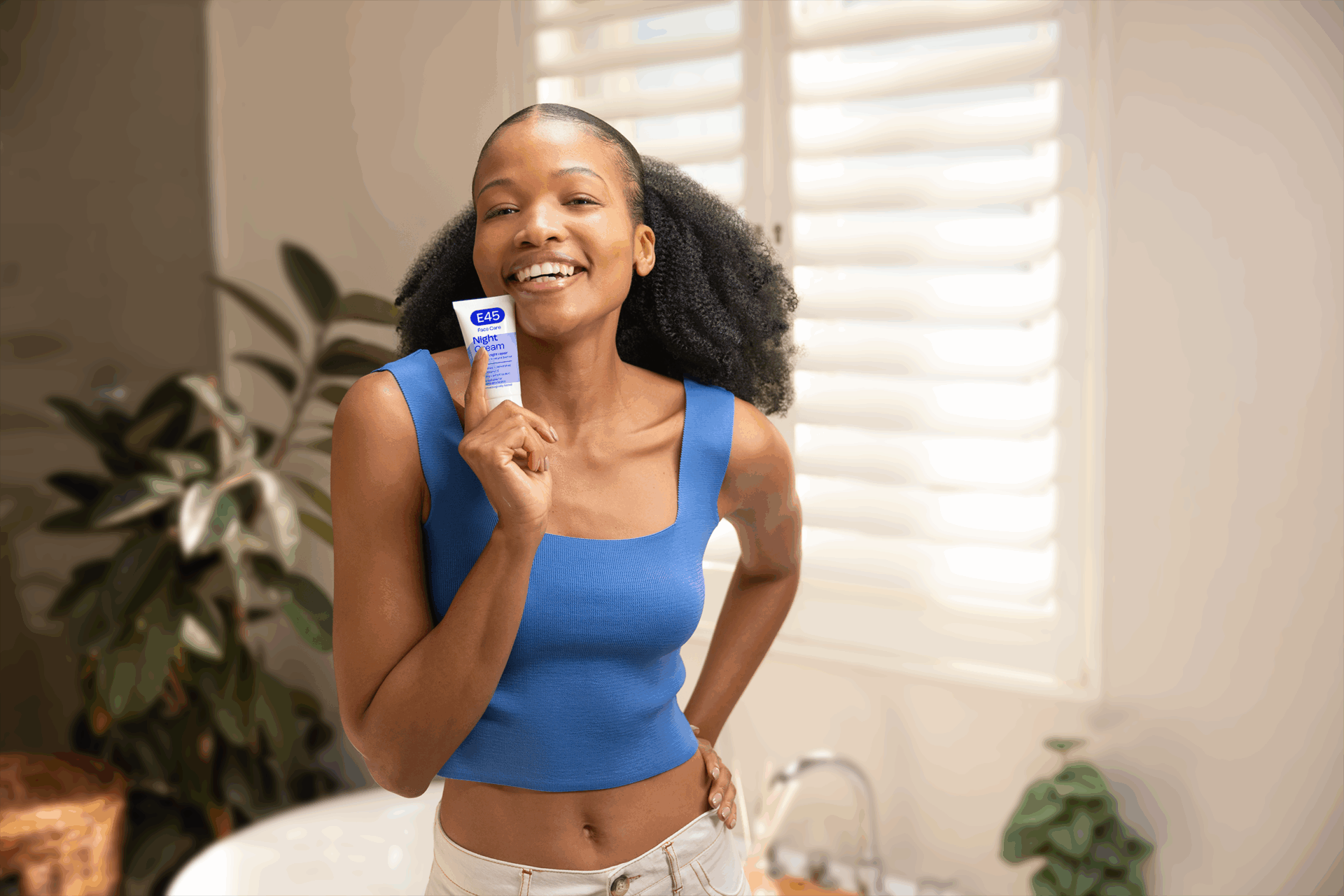 girl with great skin posing with e45 skincare product