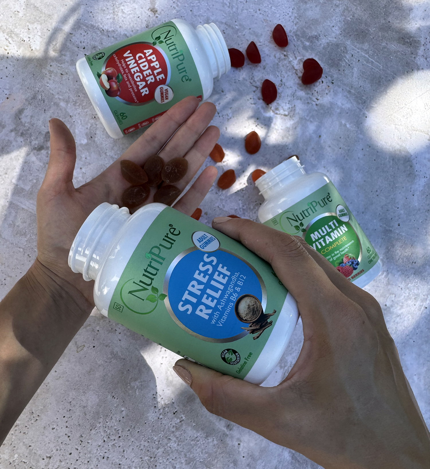 nutripure gummy vitamins products in hand