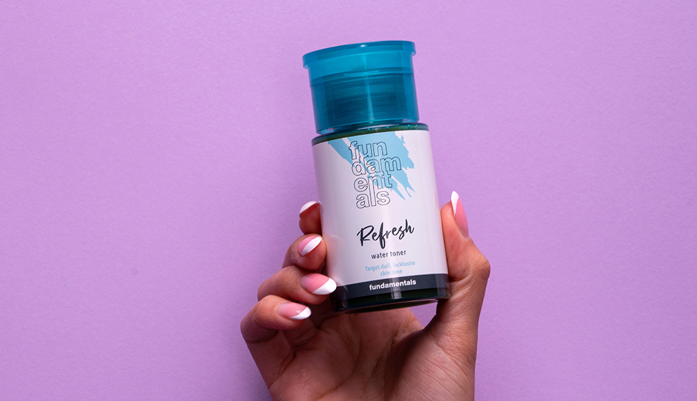 hand holding fundamentals refresh skincare product