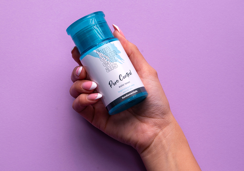 hand holding fundamentals pore control skincare product