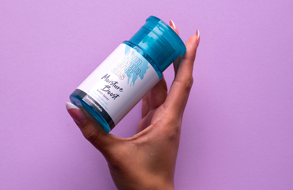 hand holding fundamentals moisture boost skincare product