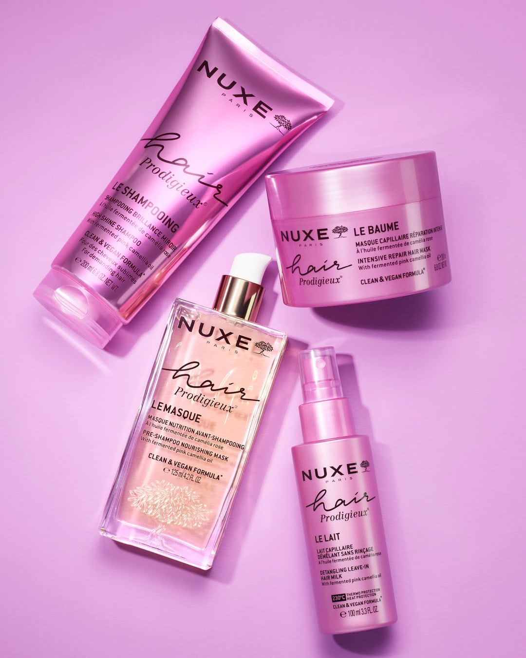 Four pink NUXE Hair Prodigieux products 