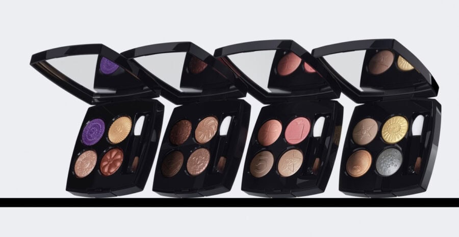 Four elegant Chanel eyeshadow palettes displayed.