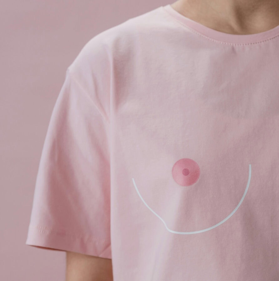 Pink shirt with playful nipple design.