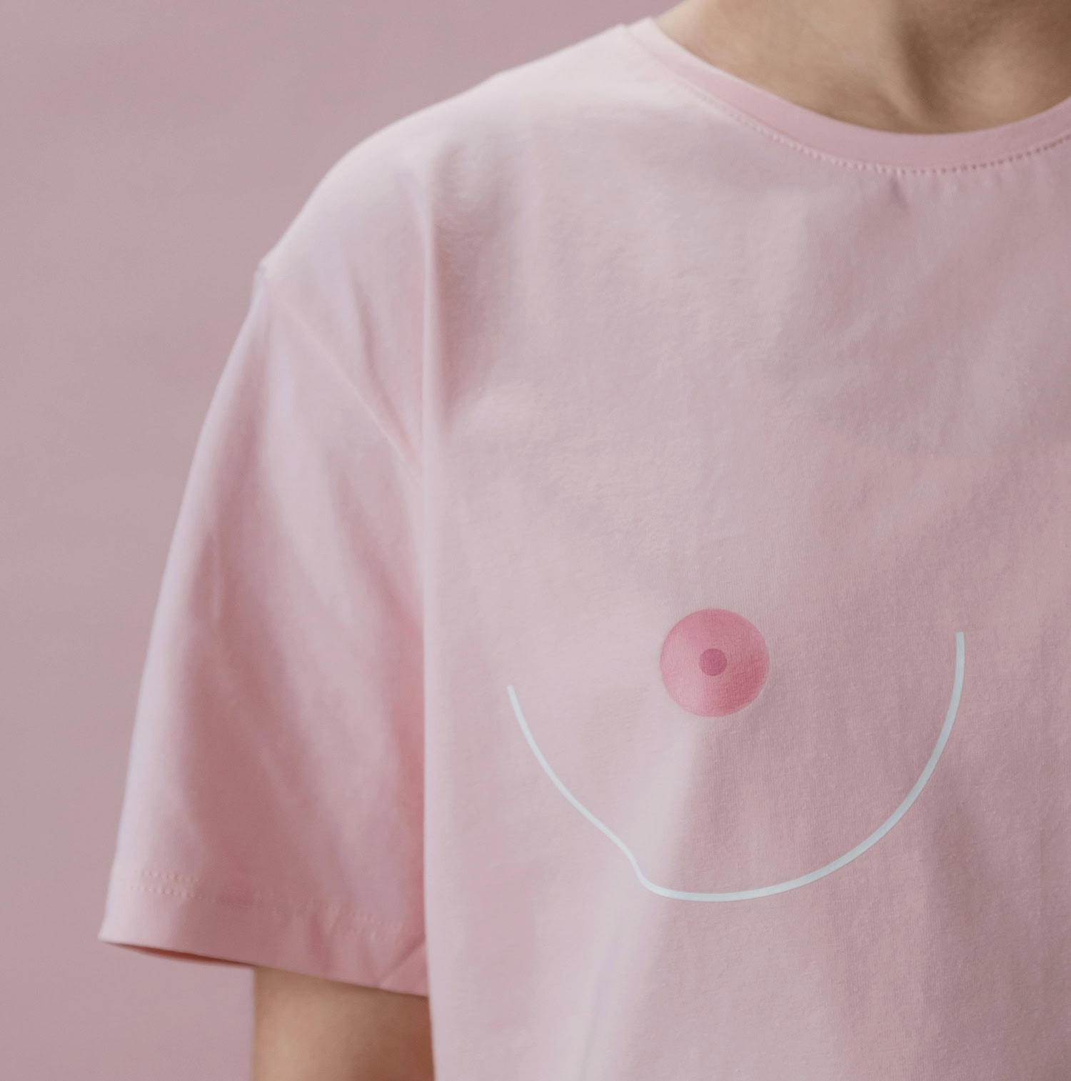 Pink shirt with playful nipple design.