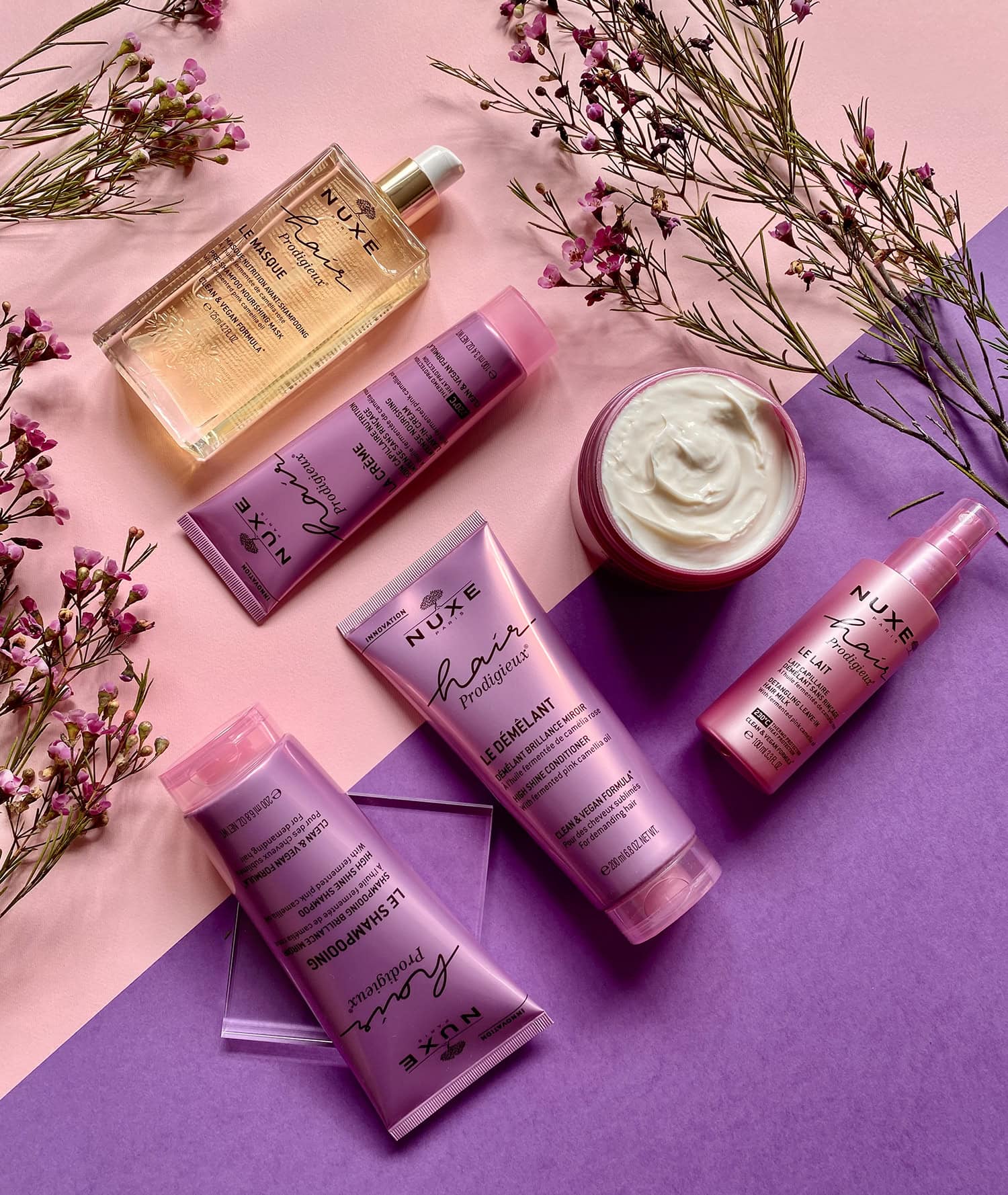 Nuxe Hair Prodigieux products on colorful background