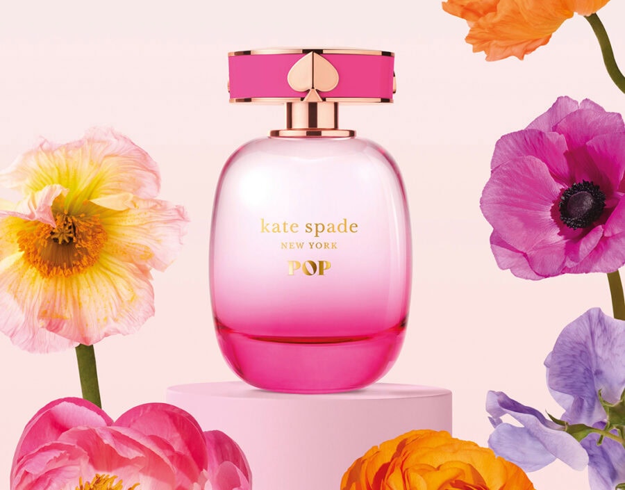 Kate Spade New York Pop perfume surrounded by flowers