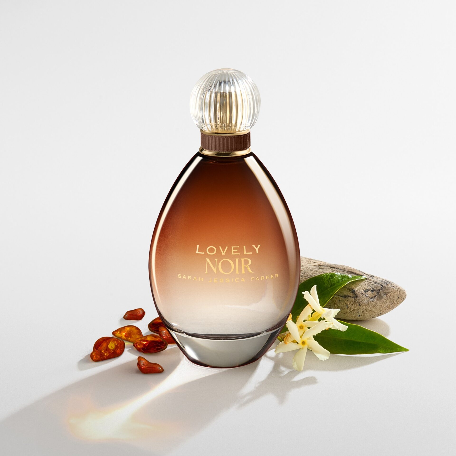 Lovely Noir fragrance bottle with ingredients