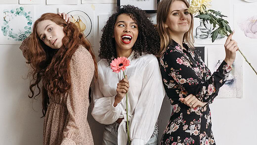 three women celebrating being winners