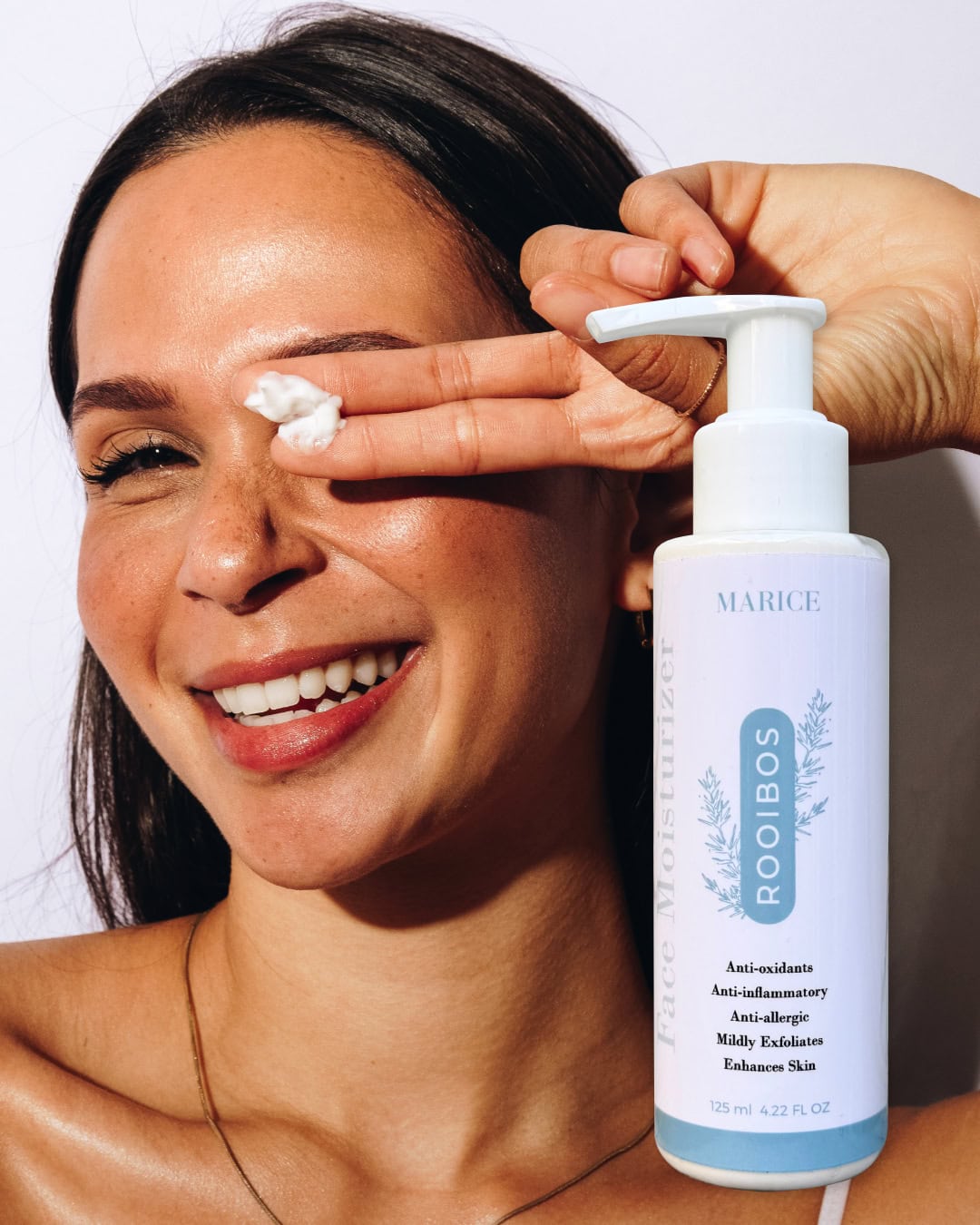 woman with Marice Rooibos lotion
